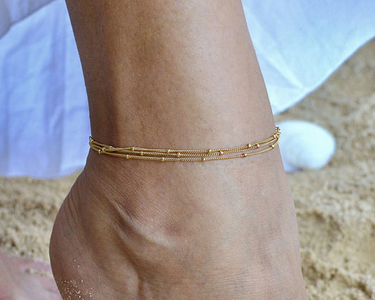 Gold Multi Chain Ankle Bracelet worn by a model