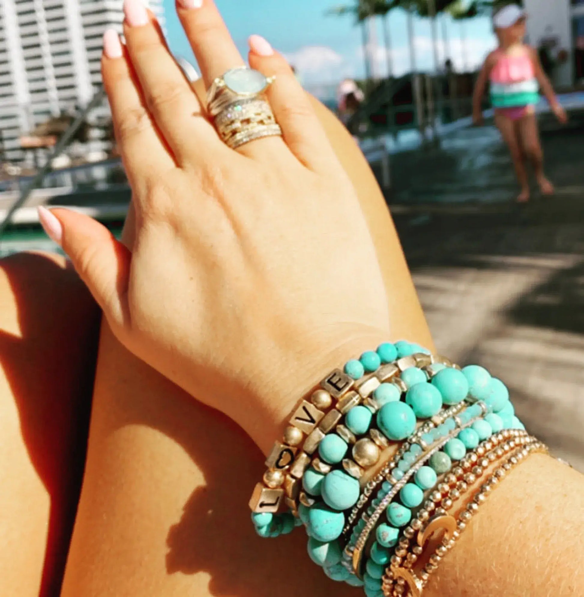 Turquoise and Soapstone Beaded Stretch Bracelet shown on a model's arm