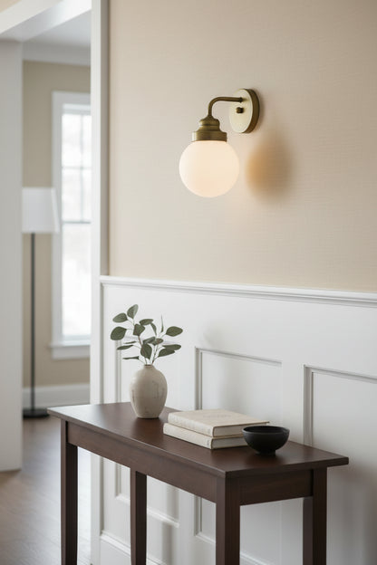 One Light Gold Wall Sconce with Round Glass Shade