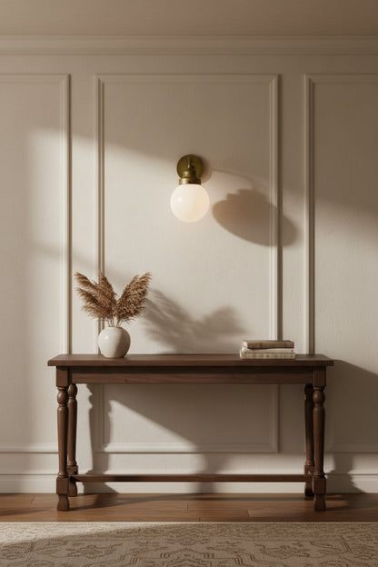 One Light Gold Wall Sconce with Round Glass Shade