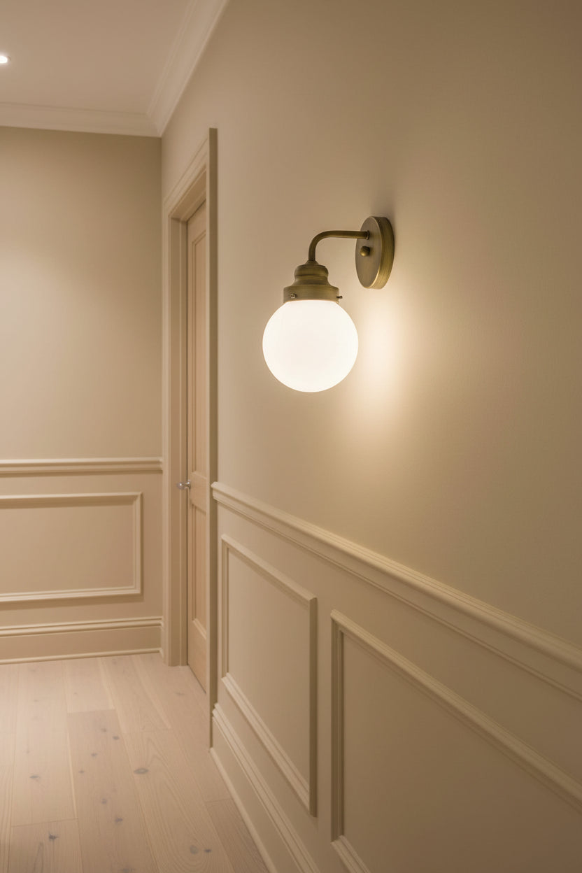 One Light Gold Wall Sconce with Round Glass Shade