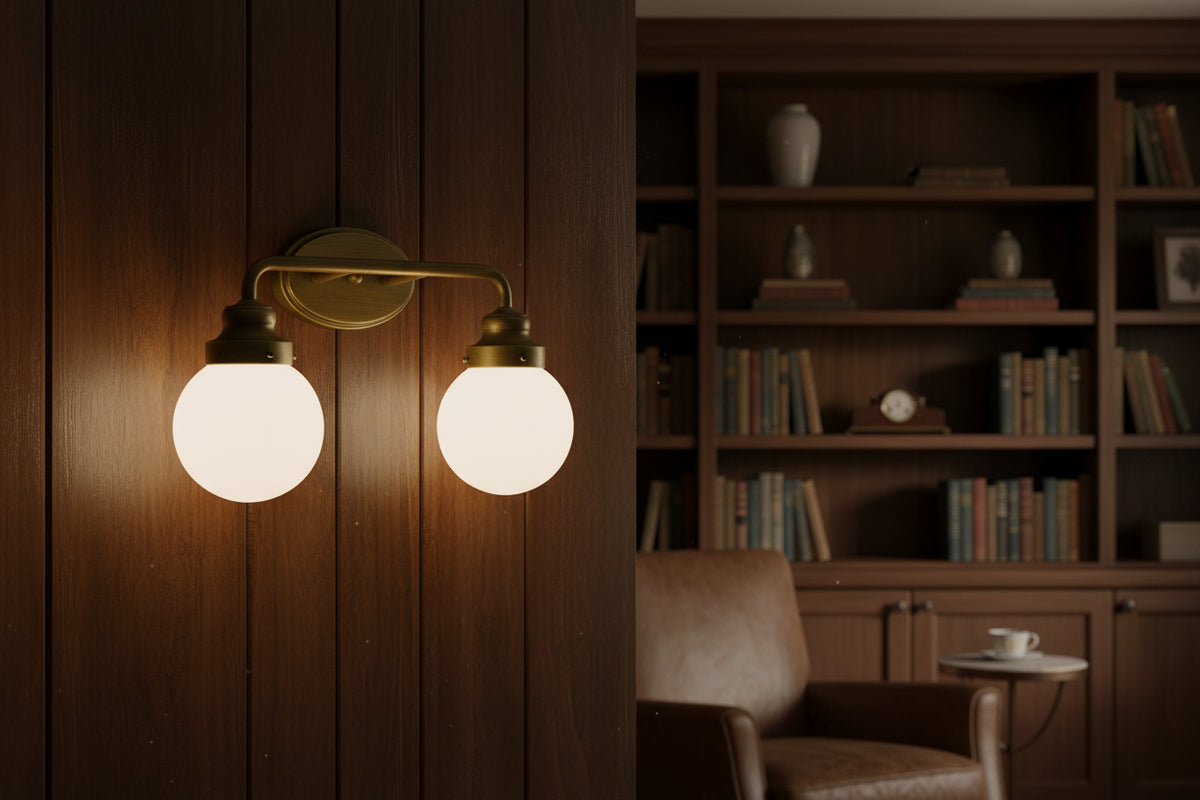 Two Light Gold Wall Sconce with Round Glass Shade
